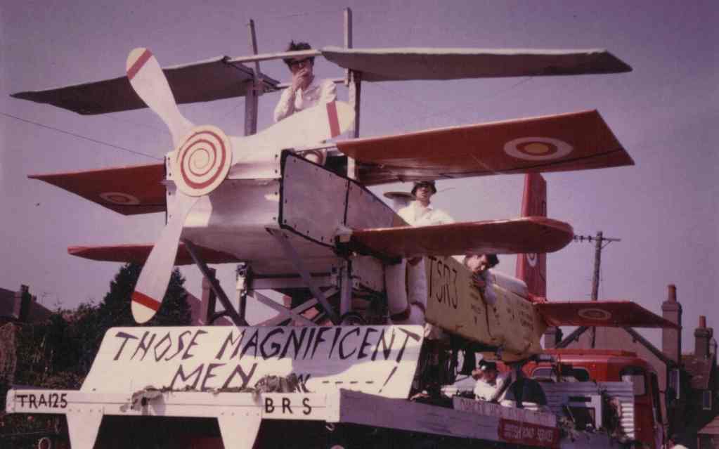 Magnificent Men in their flying machine:
This carnival float won. Pilot Chris Angus, co-pilot Ern Broadbent, co-co-pilot Jess James,
co-co-co-pilot Ian Maiden.  DJ Dave Peddler.