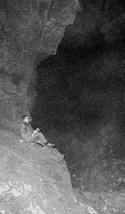 Me, (Alan Robinson) perched on a ledge in Agen Allwed.  After 1 mile of crawling, then a boulder choke, the cave opened out into this immense cavern, 1 mile long.