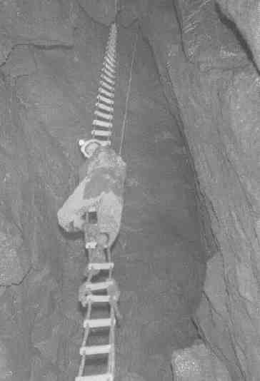 Ginge Hordell half way up some pitch that I now can't identify - possibly Swildons (Mendips).  We made all our own rope ladders etc. and we made them good!