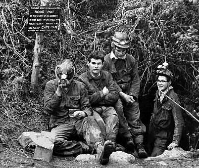 Entrance of Rods Pot (Mendips) c.1958. Bas Spinks & me on the right.  Forgotten names of others who were a year above us